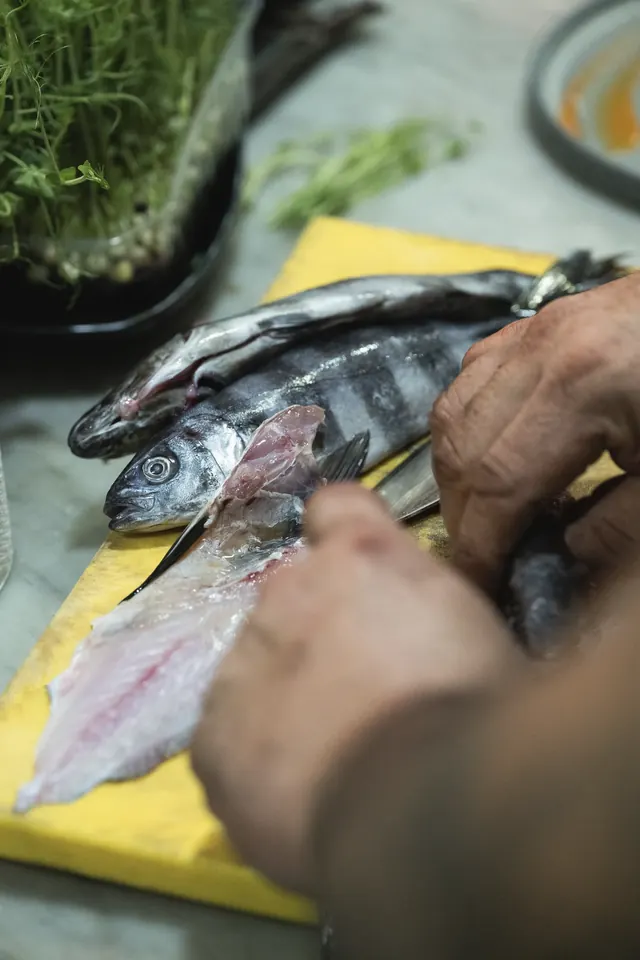 Chef preparing fresh fish in the kitchen